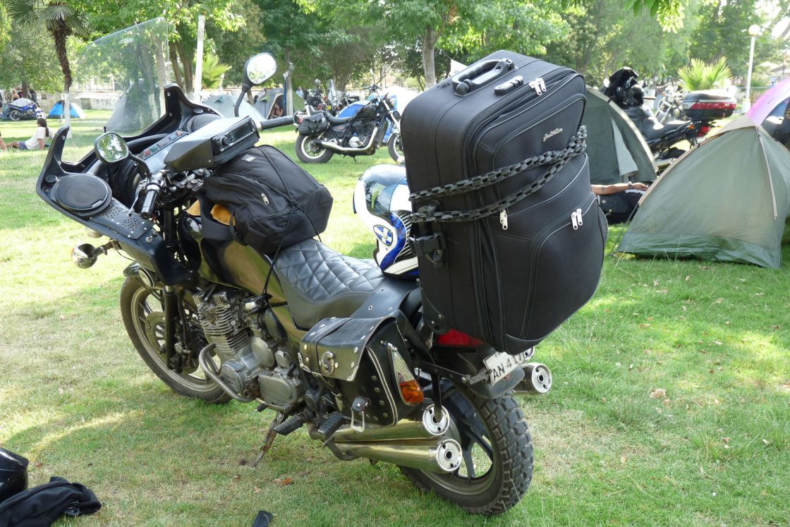 "Motorcycle with an interesting top case"