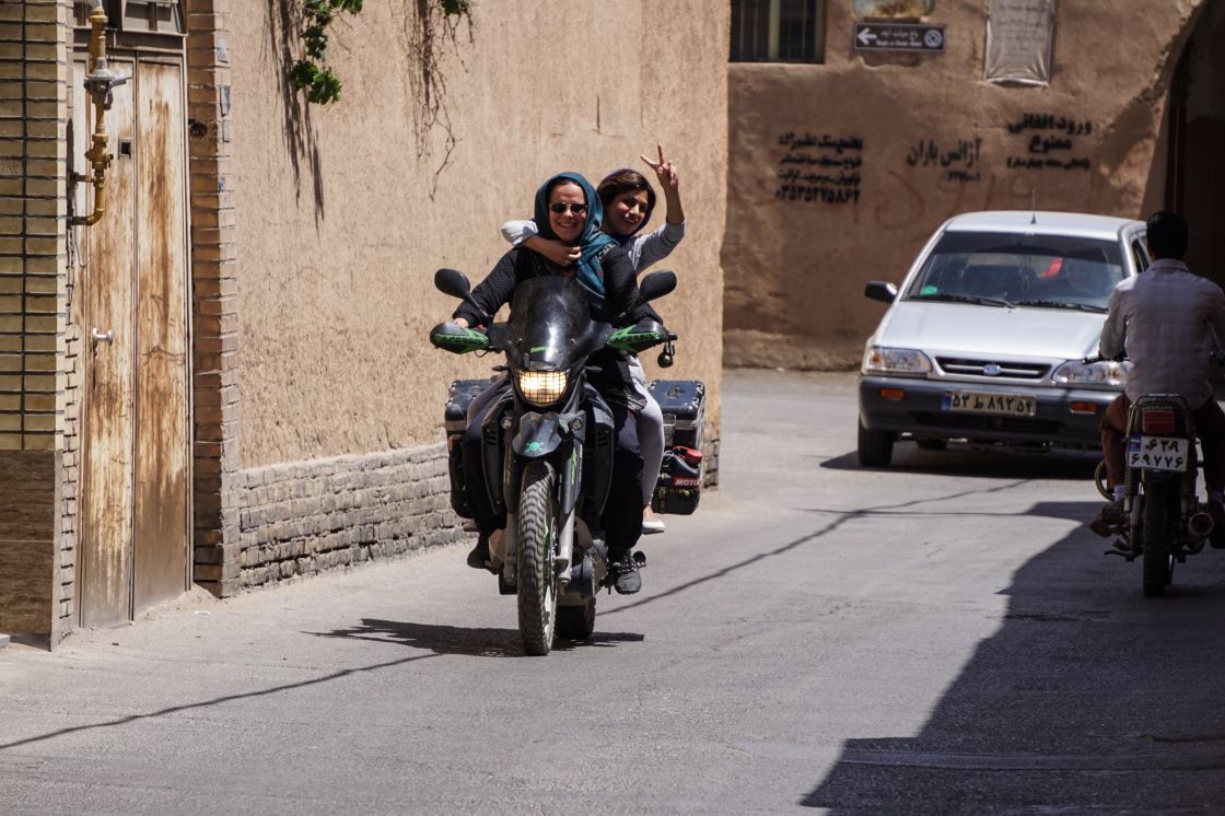 Xenia takes a local Iranian girl for a little spin, which she really enjoys. For local women it is illegal to ride a motorbike in Iran