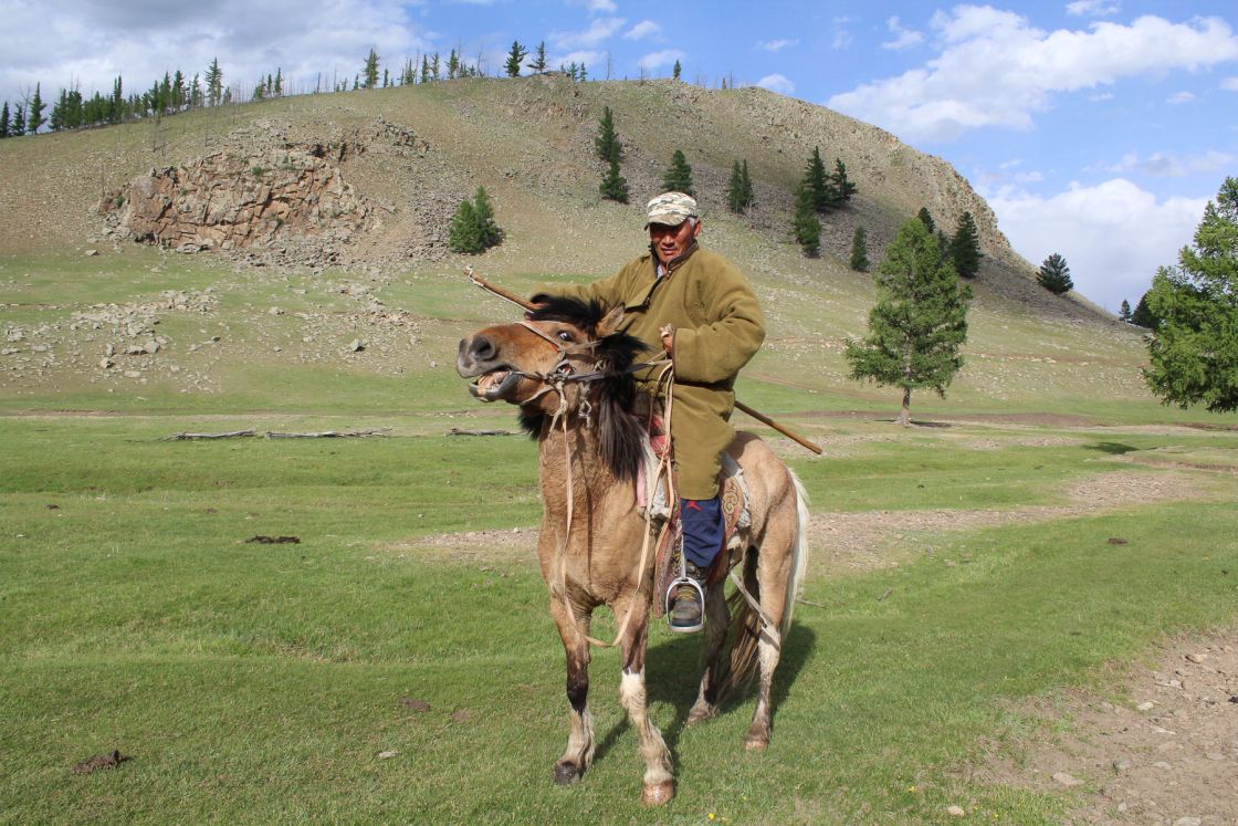 Mongolian men and his horse