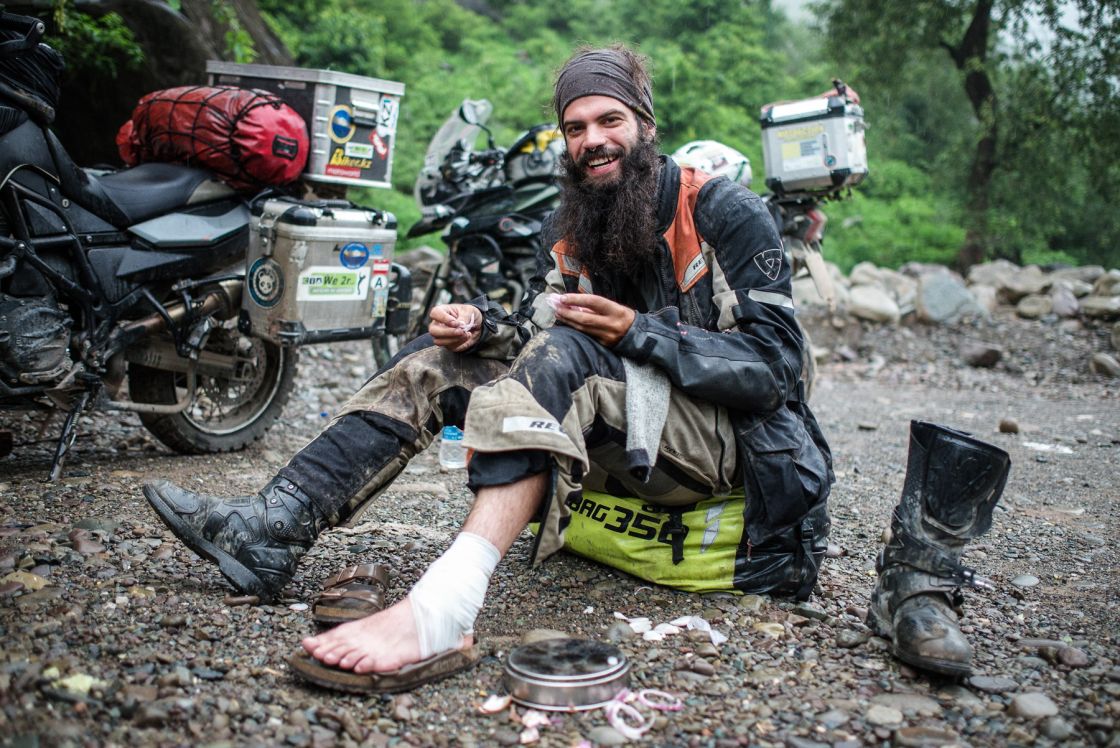 Tawi River, Kashmir – Earlier that day, the army private had waved his flag about like a cheerleader, so while at speed, I decided to drop my bike – right on top of my ankle. The following morning, Evelyn (our residing doctor while together in India) patched me up with another bandage change and an onion dressing. Don’t ask, it works, trust me. 