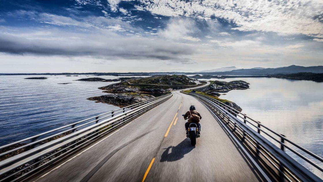 The well-known Atlantic Road, connecting islands in a gently meandering series of bridges. Calm in breezy sunshine, a mad battle with the elements in wind and rain