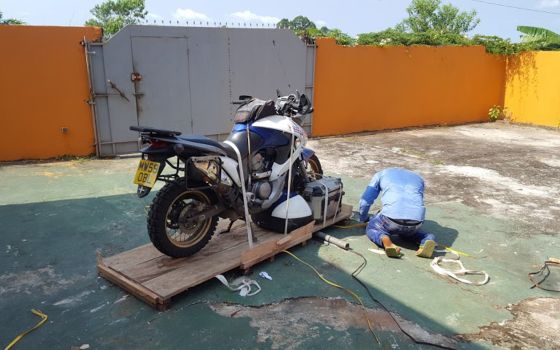 Gabon - unwrapping the bike after its flight