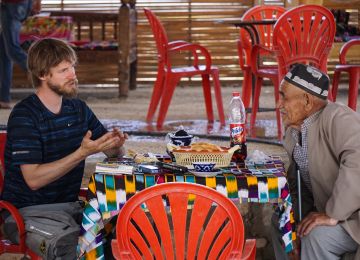 Even with some language barriers you can always find a way to communicate (Martin with a local Uzbek man)