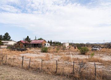 A common sight around rural Texas. Many villages had abandoned property. Sad but also beautiful in its own way.