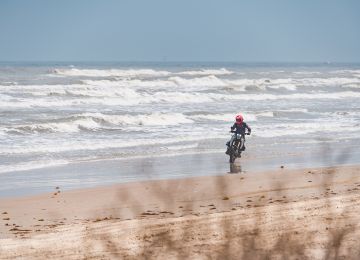 Riding on the beach feels off, but oh, so fun! Robert Baldinger doing his best Baywatch impression.