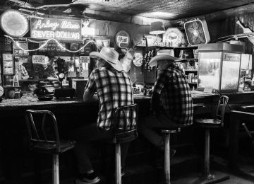 Two Swedes and a Texan walk into a bar and reenact the classic sad-cowboys-on-a-row-at-the-bar scene.